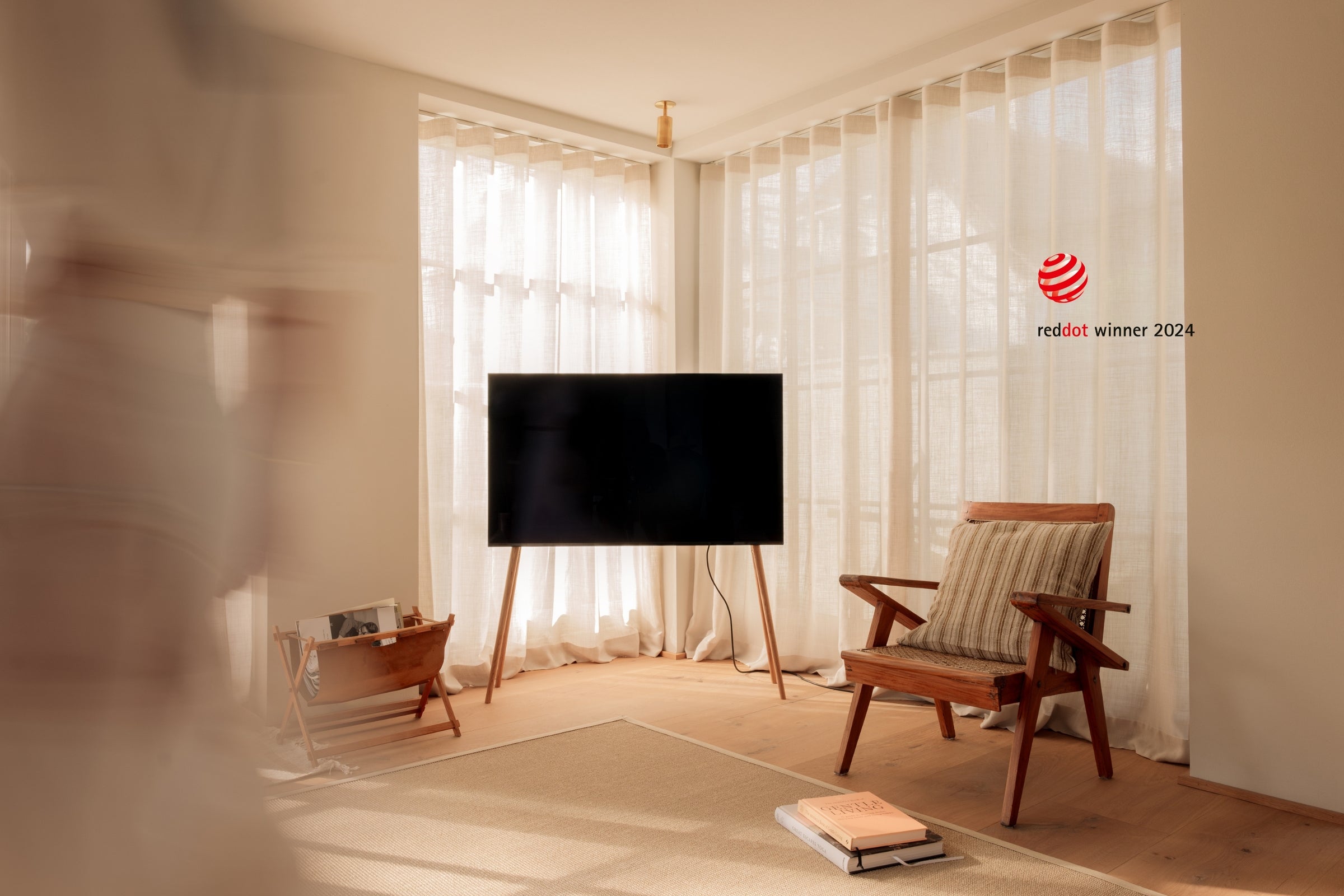 Freestanding JALG TV stand in a mid-century modern living room, Red Dot Winner 2024, desktop layout