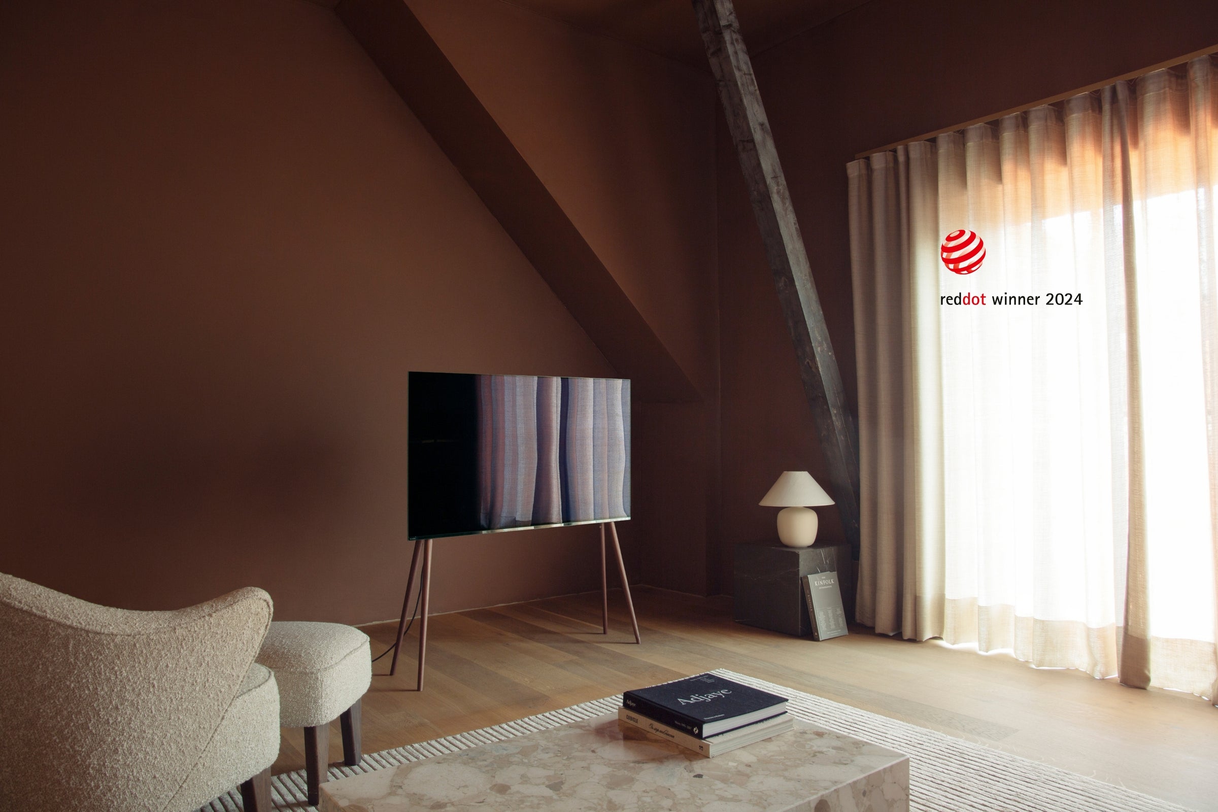 Freestanding JALG TV stand in a modern attic room, Red Dot Winner 2024, desktop layout